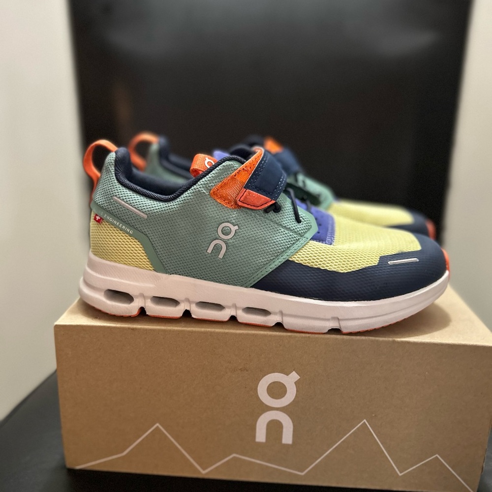 On Running Green and Yellow Sneakers with Cloud Cushioning